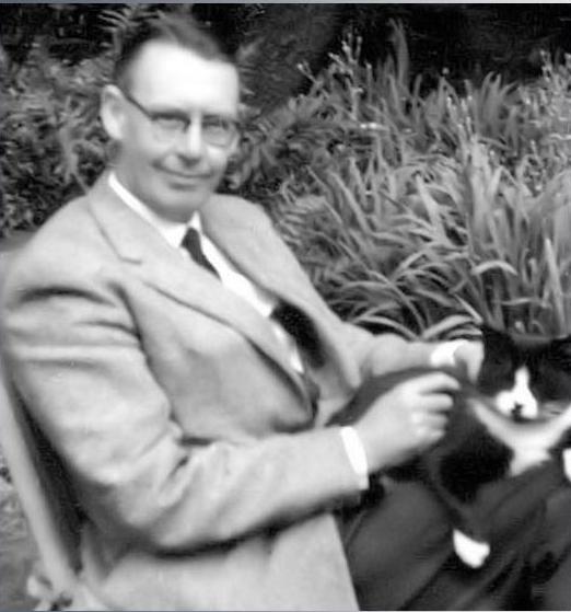 Kenneth Allott, with one of his many beloved cats.