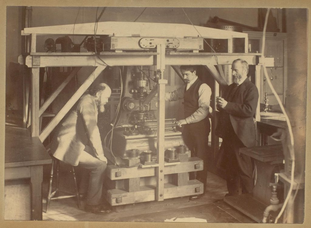 Professor Oliver Lodge, Mr Benjamin Davies, and Mr George Holt with an Ether machine