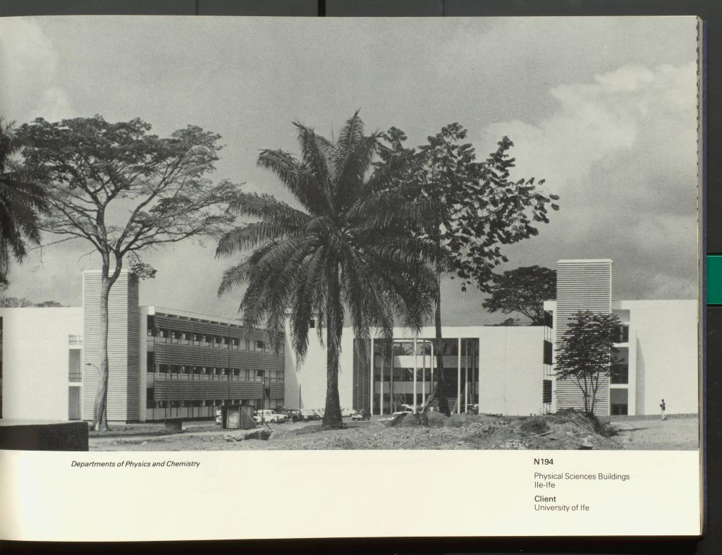 Black and white photograph of building and grounds in foreground